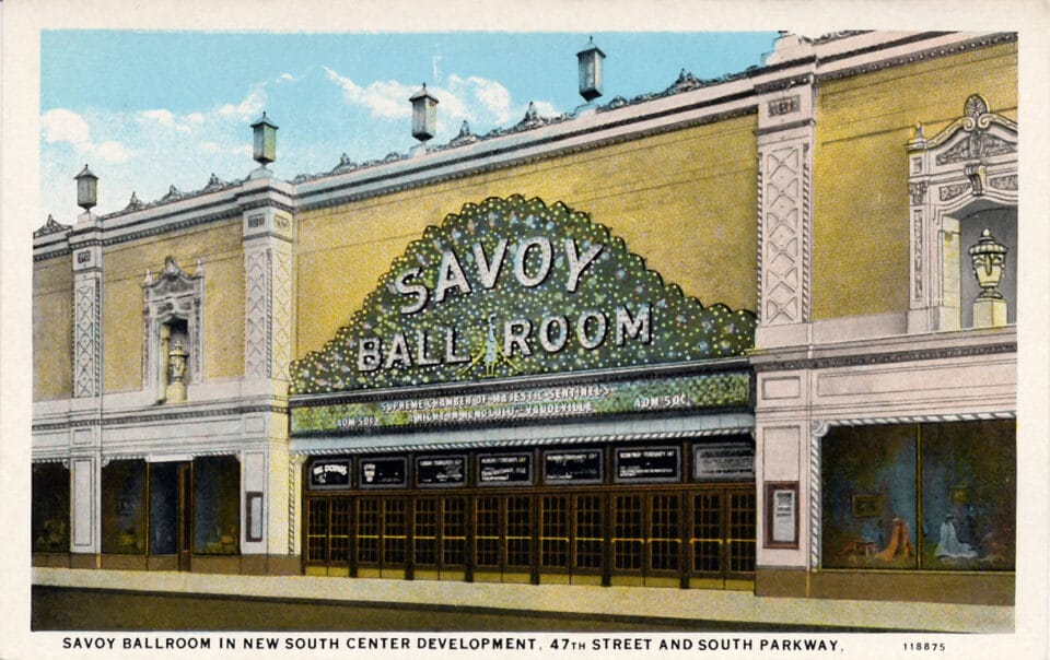 a yellow building with a green sign that says "savoy ballroom"
