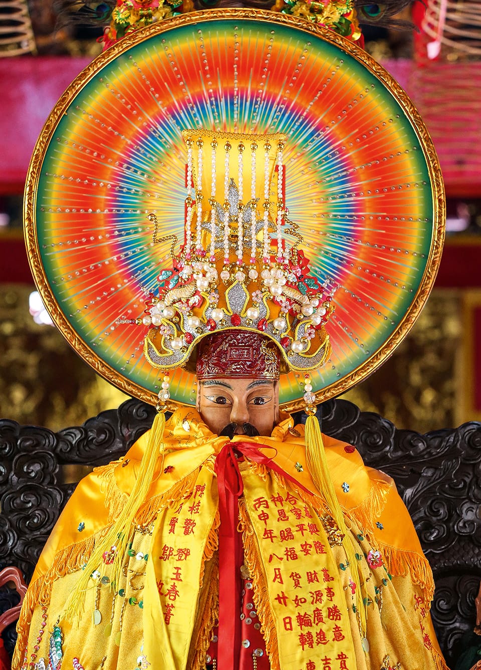 a Taoist deity depicted in vibrant colors with a prismatic halo